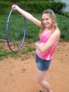 Petite teen Shelby plays around with a hoola hoop