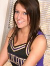 Watch as a slutty cheerleader strips out of her uniform showing off her huge tits