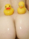 Emma has a shower with lots of bubbles and her rubber ducks
