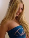 Busty blond teen in a blue tube top