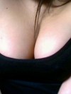 Teens huge tits are almost falling out of her lowcut tanktop