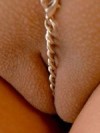 Brookes tight pussy is only covered by a little chain