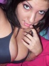 Nikki takes pictures of herself in a black tiny bra which her tits are almost falling out of