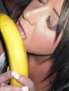 Sexy Monroe shows off her oral skills on a banana and then strips naked